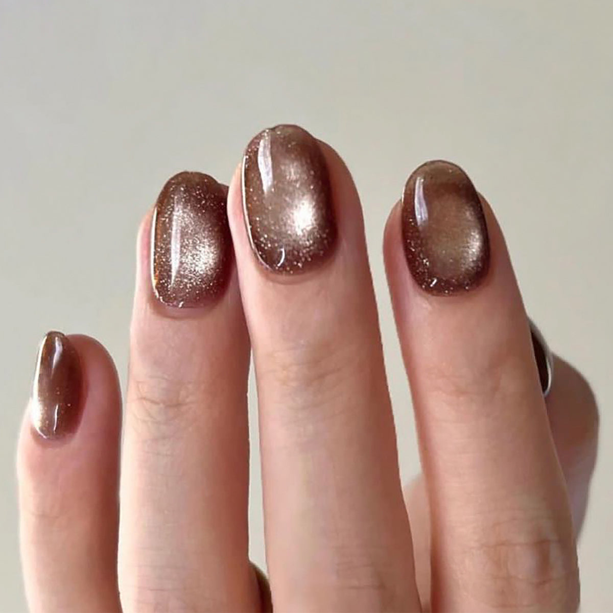Short Round Deep Brown Nail Tips with Cat-Eye Effect - Brighten Skin