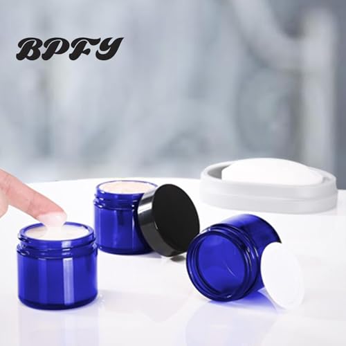 24 Pack 2 oz Round Blue Glass Cosmetic Jars with Inner Liners and Black Lids, Travel Jars, Refillable Containers for Makeup, Cream, Lotion, Sugar Scrubs, Eye Shadow, Slime, Paint, Jewelry