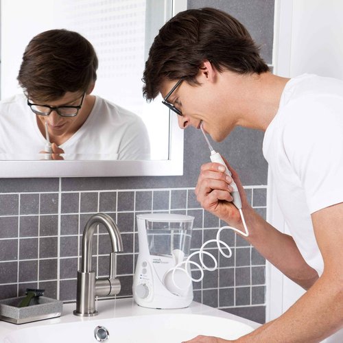 Bundle with Waterpik Aquarius Water Flosser, White WP-660 with Convenient, Hygienic and Sturdy Tip Storage Case with 6 Replacement Flossing Tips, Electric Dental Countertop Professional Oral Irrigator