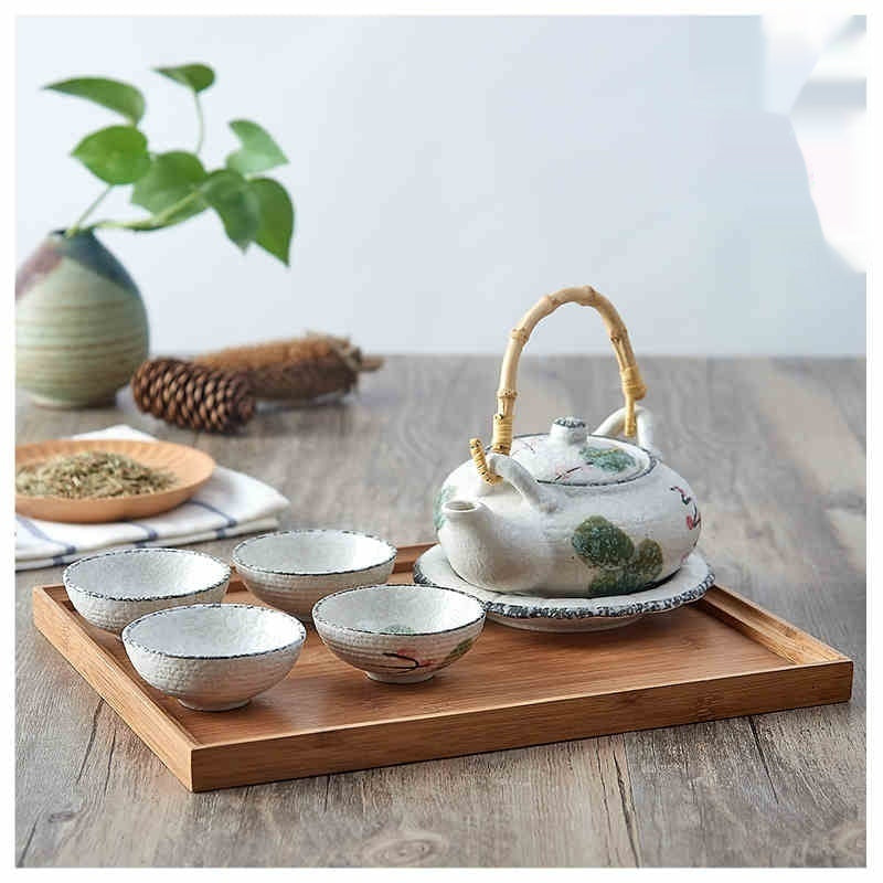 Japanese Style Porcelain Tea Set with Lifting Handle and Black Stone Design